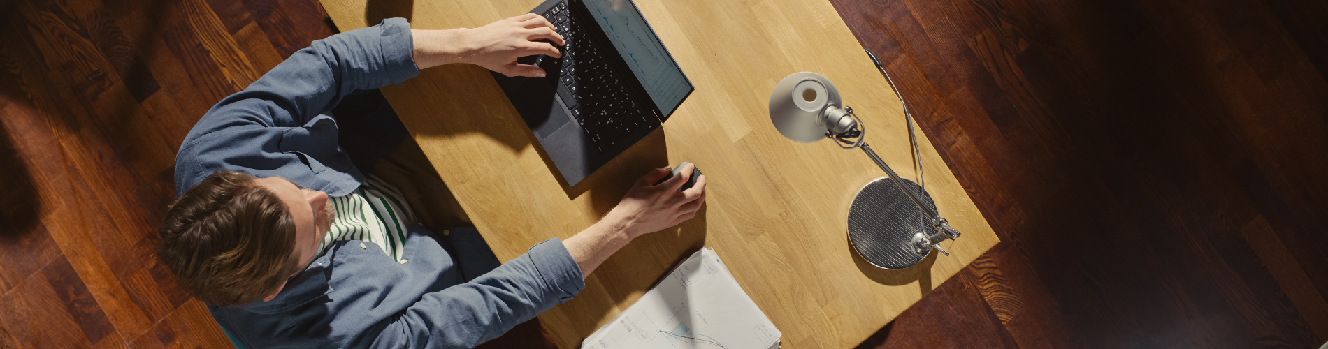 Developer Working on Laptop at Desk